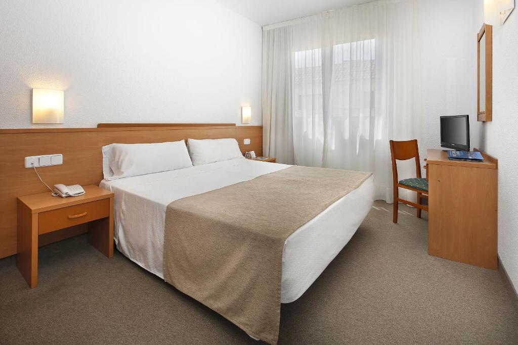 Postel nebo postele na pokoji v ubytování Hotel Montsia