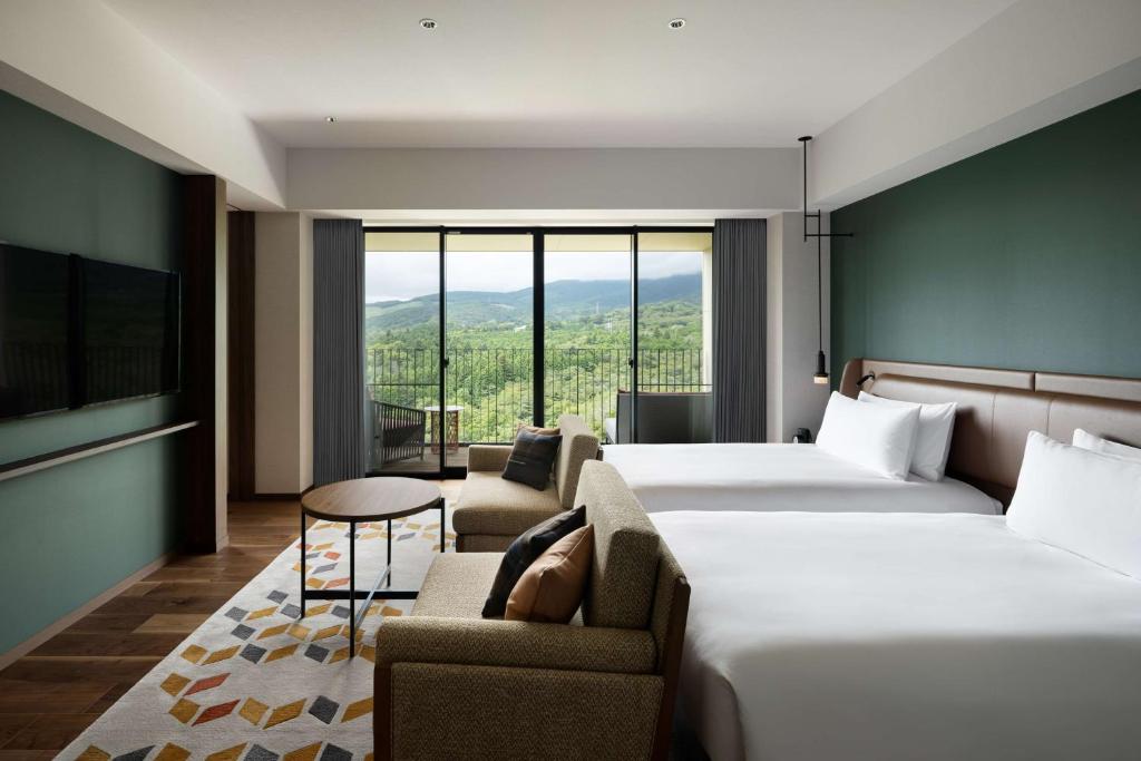 Ένα ή περισσότερα κρεβάτια σε δωμάτιο στο Fuji Speedway Hotel, in The Unbound Collection by Hyatt
