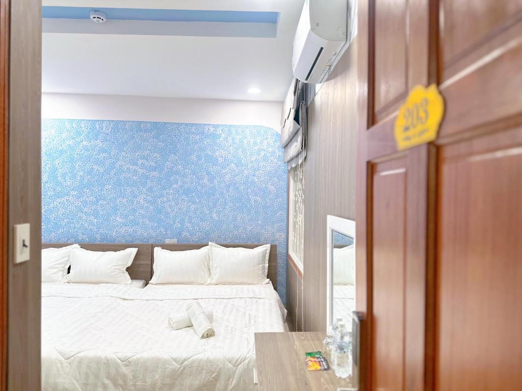 Кровать или кровати в номере Milanesa Hotel and Apartment