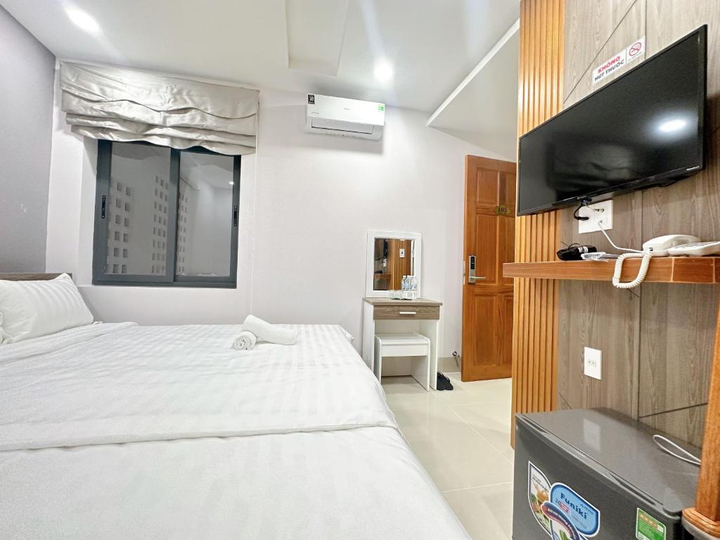 Телевизор и/или развлекательный центр в Milanesa Hotel and Apartment