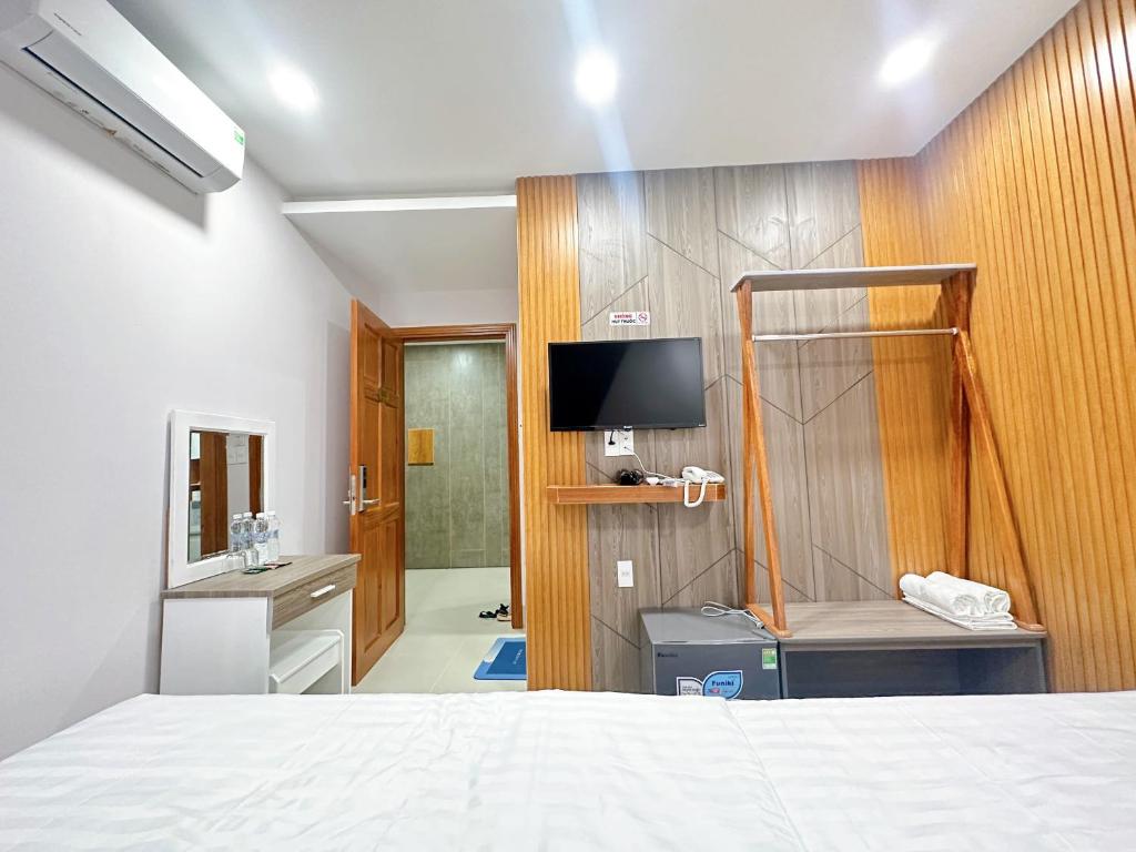 Кровать или кровати в номере Milanesa Hotel and Apartment