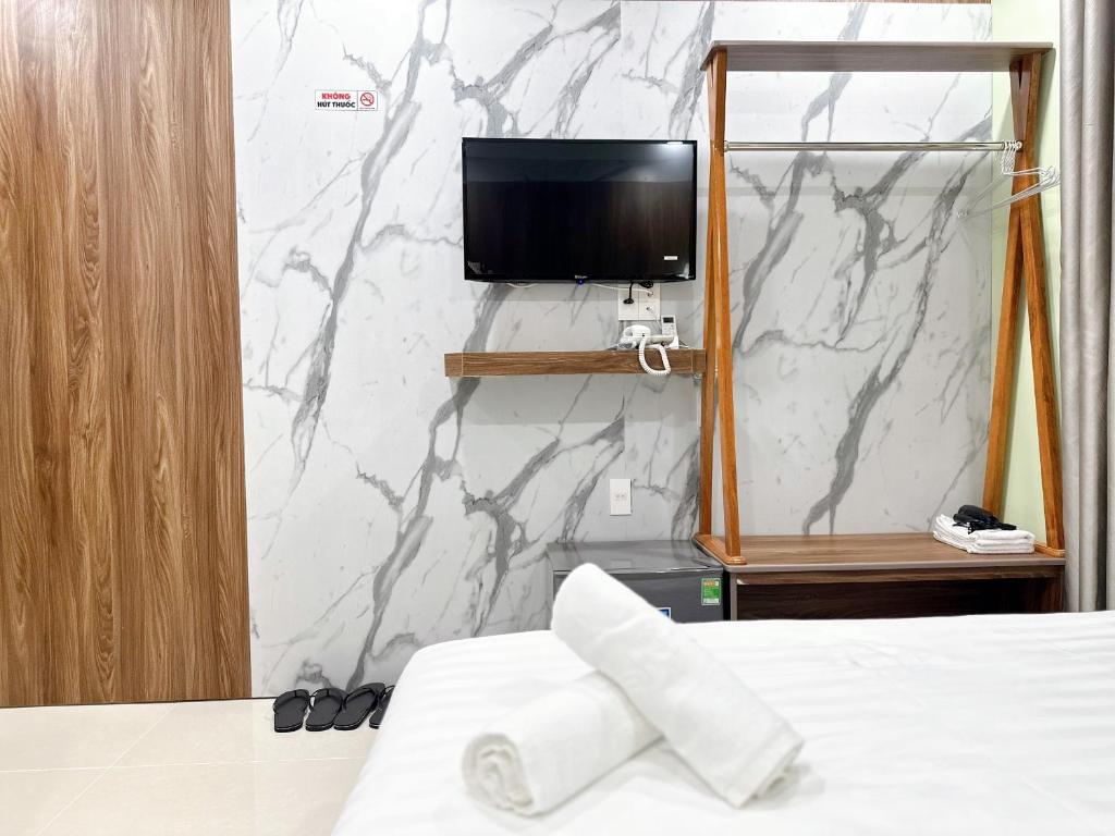 Кровать или кровати в номере Milanesa Hotel and Apartment