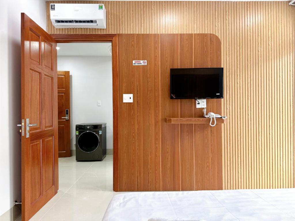 Телевизор и/или развлекательный центр в Milanesa Hotel and Apartment