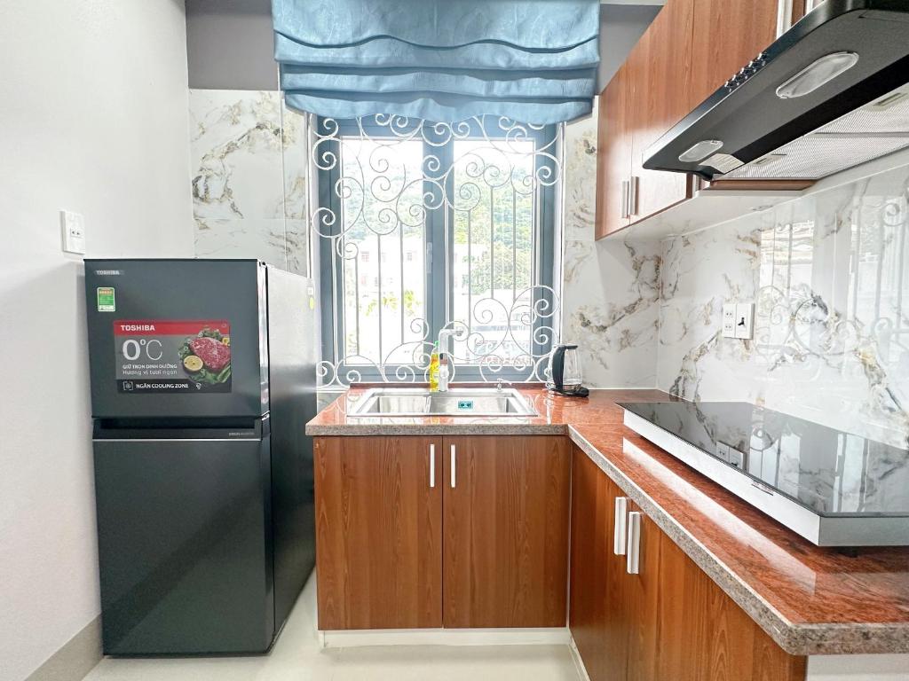 Кухня или мини-кухня в Milanesa Hotel and Apartment
