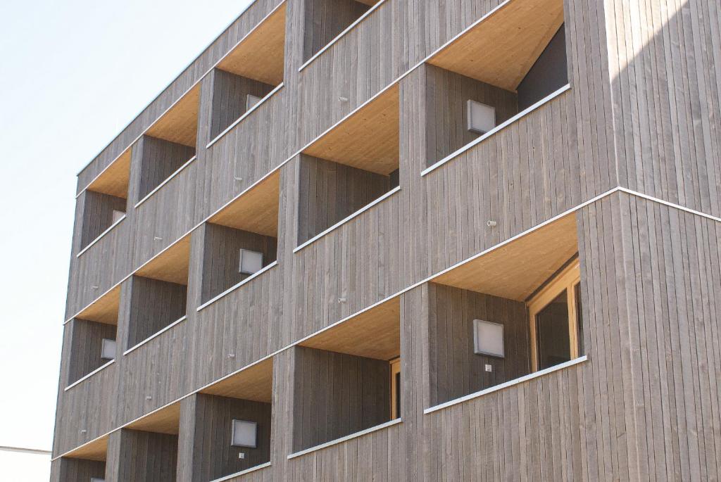 a building with balconies on the side of it at Aparthouse Leonhard in Feldkirch