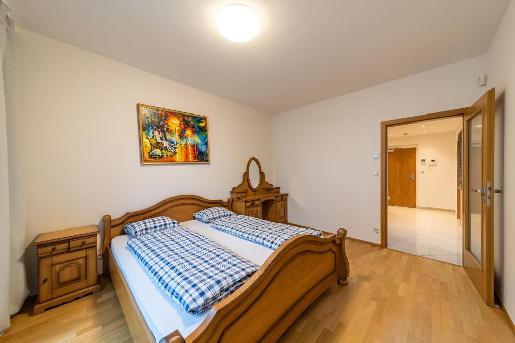 Postel nebo postele na pokoji v ubytování Garden Towers Apartments