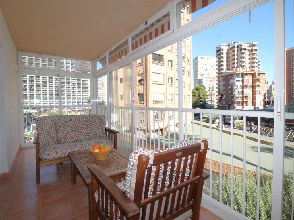a balcony with a table and chairs on a balcony at Apartment El Junco by Interhome in Benidorm