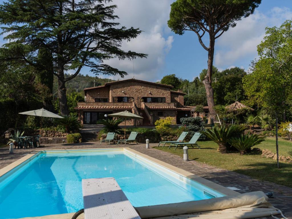 a swimming pool in front of a house at Villa Villa Valentina by Interhome in Pisciarelli