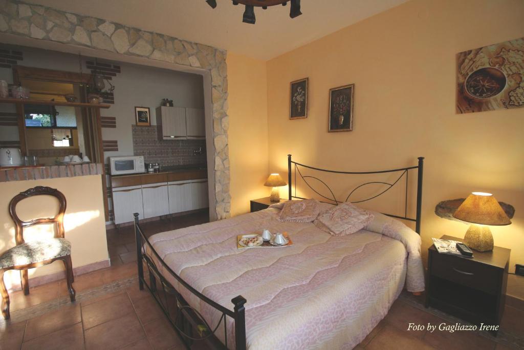 Postel nebo postele na pokoji v ubytování B&B Le Palme d'Oro