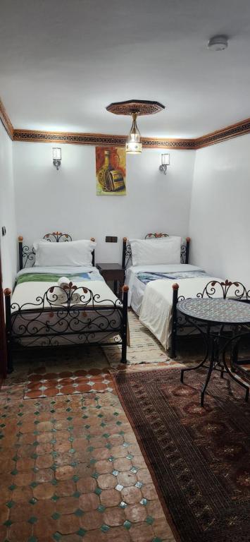 Postel nebo postele na pokoji v ubytování Riad Royal