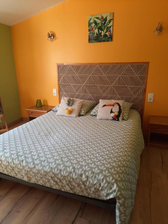 Postel nebo postele na pokoji v ubytování L'Amandier