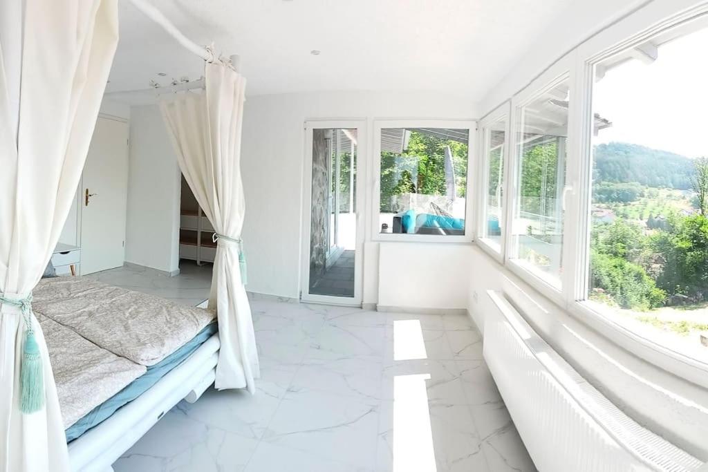 Postel nebo postele na pokoji v ubytování Ferienhaus Südschwarzwald