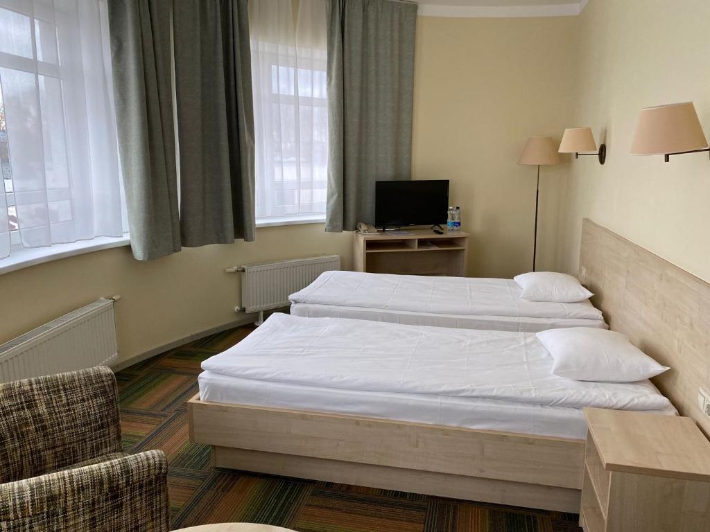 Postel nebo postele na pokoji v ubytování Kolonna Hotel Rēzekne