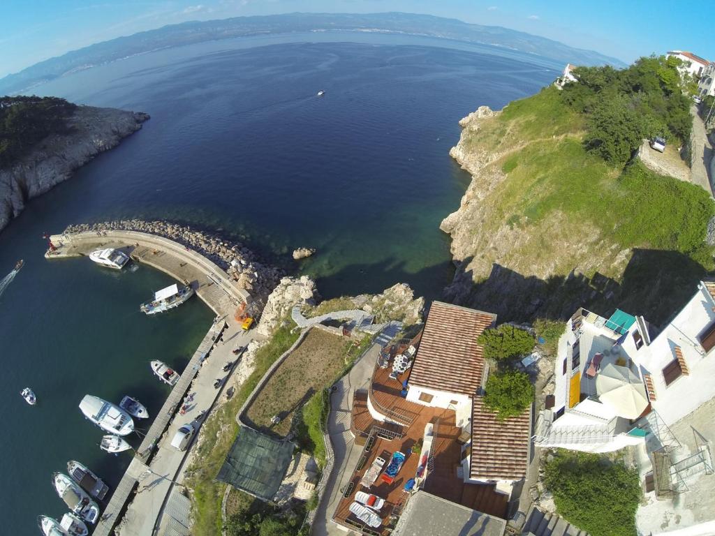 an aerial view of a harbor with boats in the water at Old Town Vrbnik Villas in Vrbnik