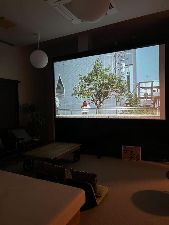 TV a/nebo společenská místnost v ubytování Nagasaki House Burabura