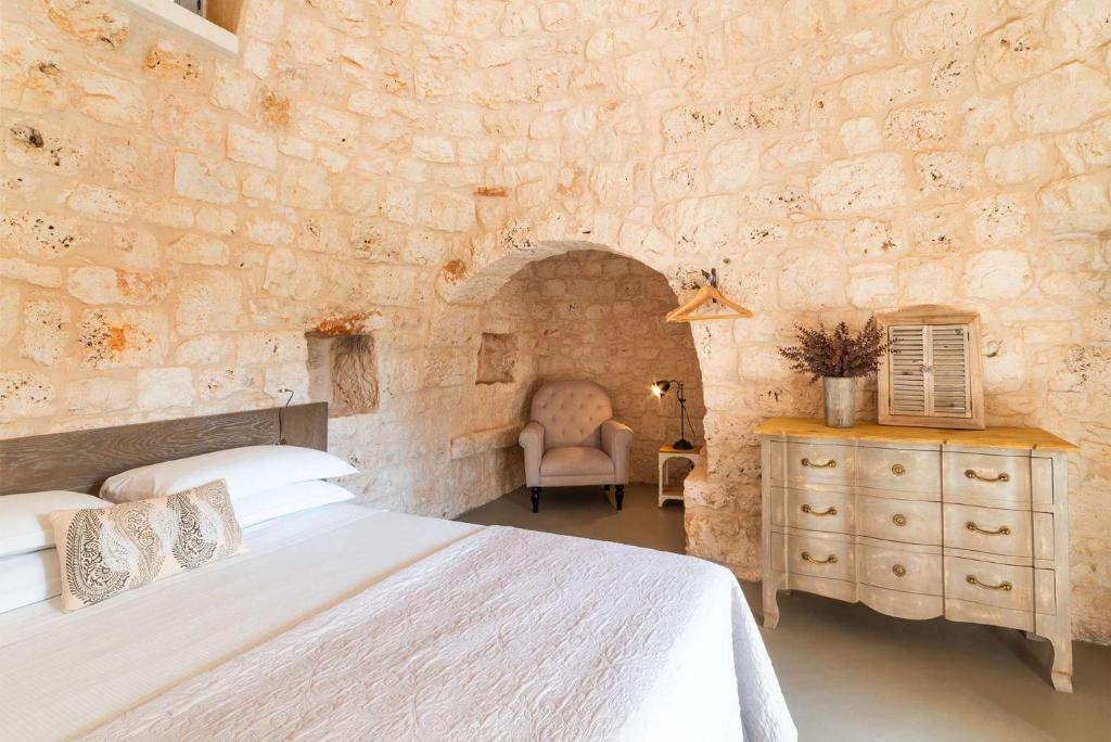 Posteľ alebo postele v izbe v ubytovaní Trullo La Specchia