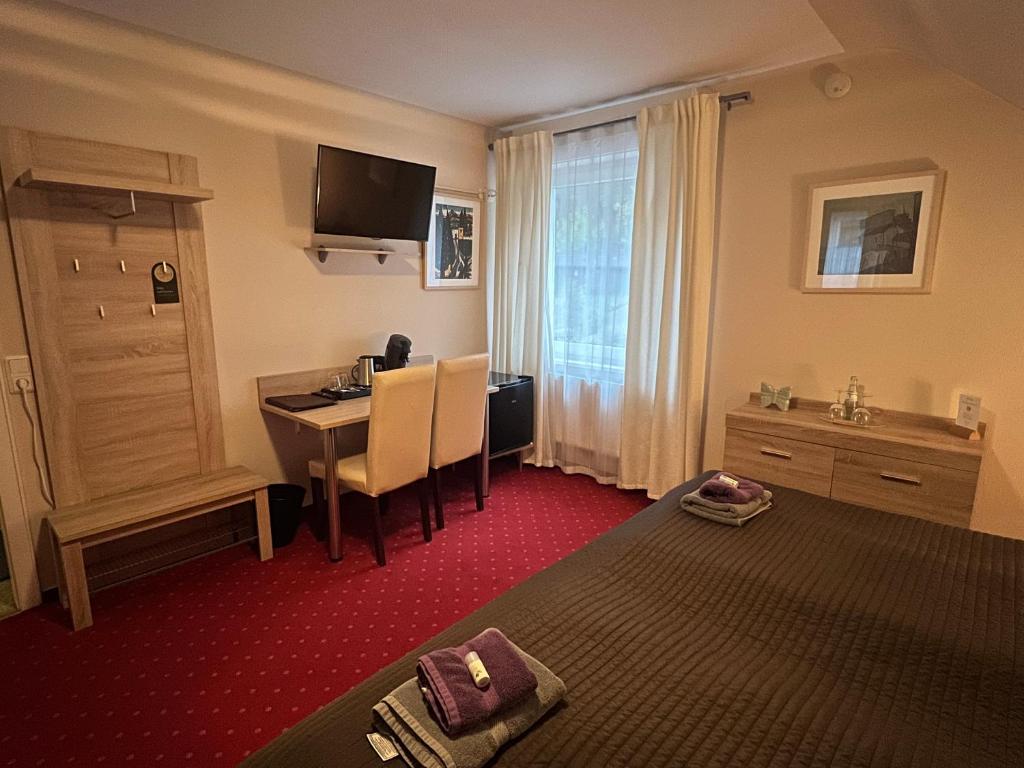 TV a/nebo společenská místnost v ubytování Hotel Sonnenhof