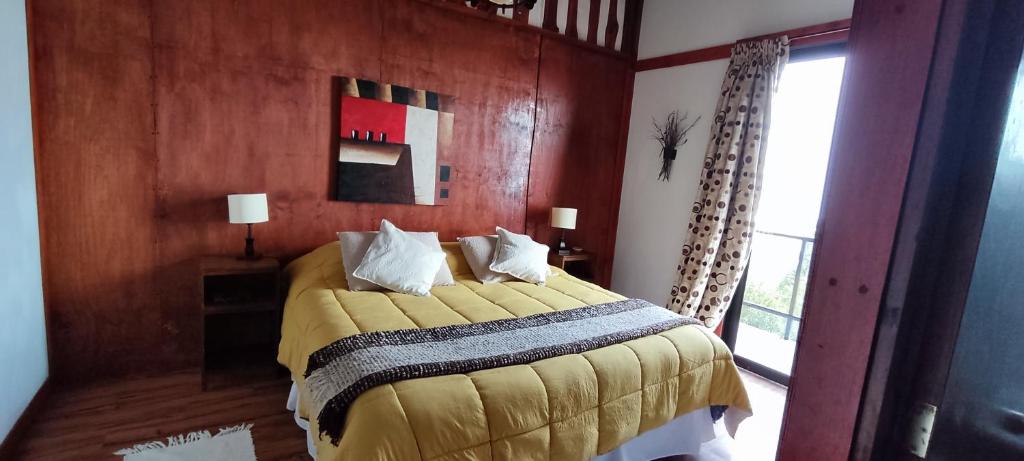 Postel nebo postele na pokoji v ubytování Refugio Los Cipreses Hotel