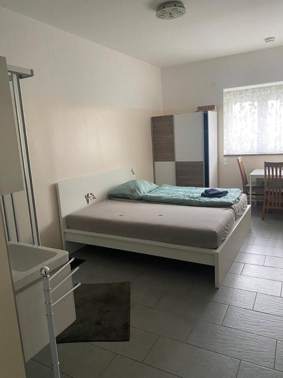 Postel nebo postele na pokoji v ubytování WIT - Wohnen in Tallesbrunn