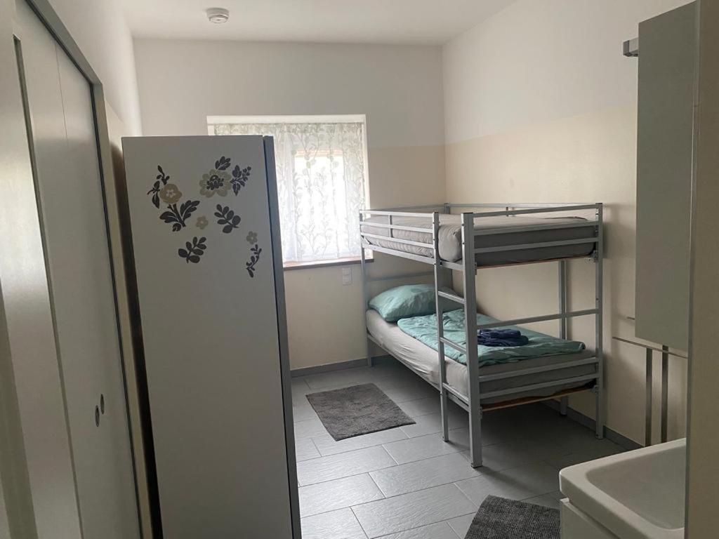 Postel nebo postele na pokoji v ubytování WIT - Wohnen in Tallesbrunn
