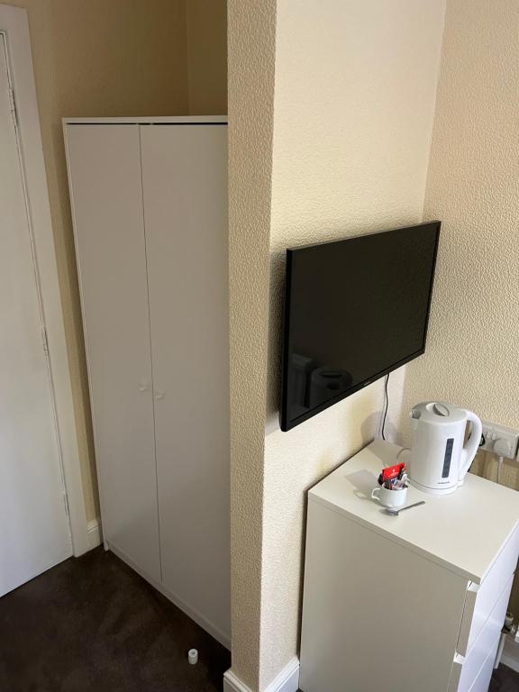 TV a/nebo společenská místnost v ubytování The Stump Cross inn