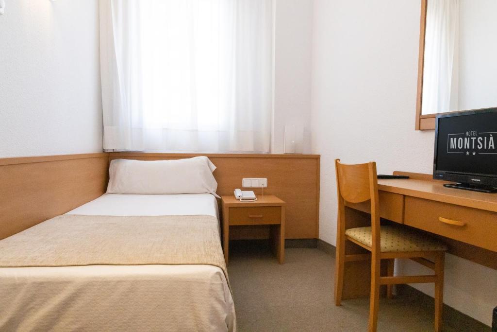 Postel nebo postele na pokoji v ubytování Hotel Montsia