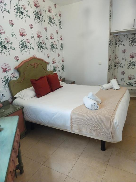 Łóżko lub łóżka w pokoju w obiekcie CENTRO ANTEQUERA Apartamento Calzada Centro