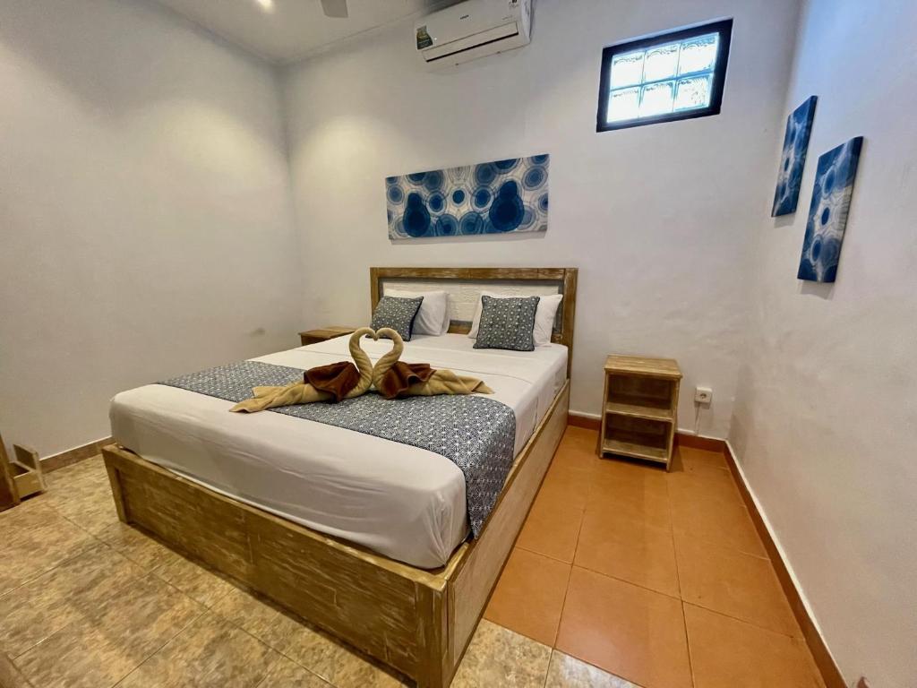 Krevet ili kreveti u jedinici u objektu Asri Bali Sanur Apartment