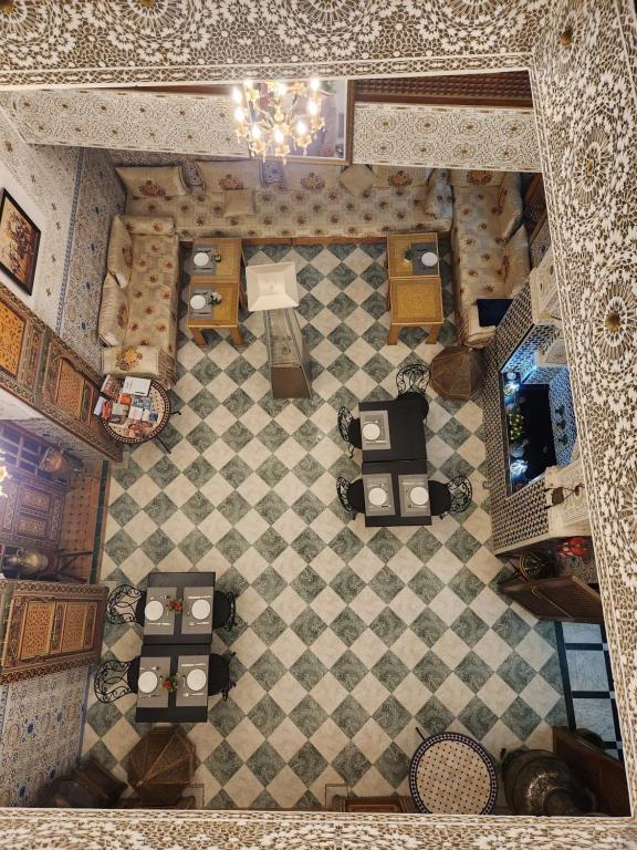 an overhead view of a toy kitchen with a checkered floor at Riad Royal in Meknès