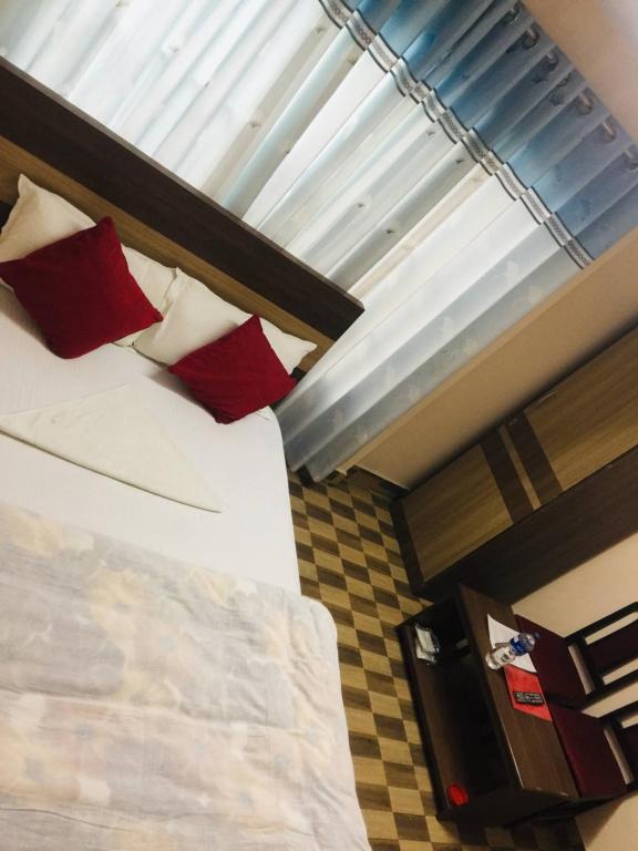Postel nebo postele na pokoji v ubytování Hotel Rajdhani Visit