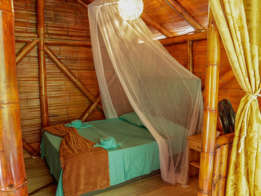 Postel nebo postele na pokoji v ubytování Glamping Río Claro