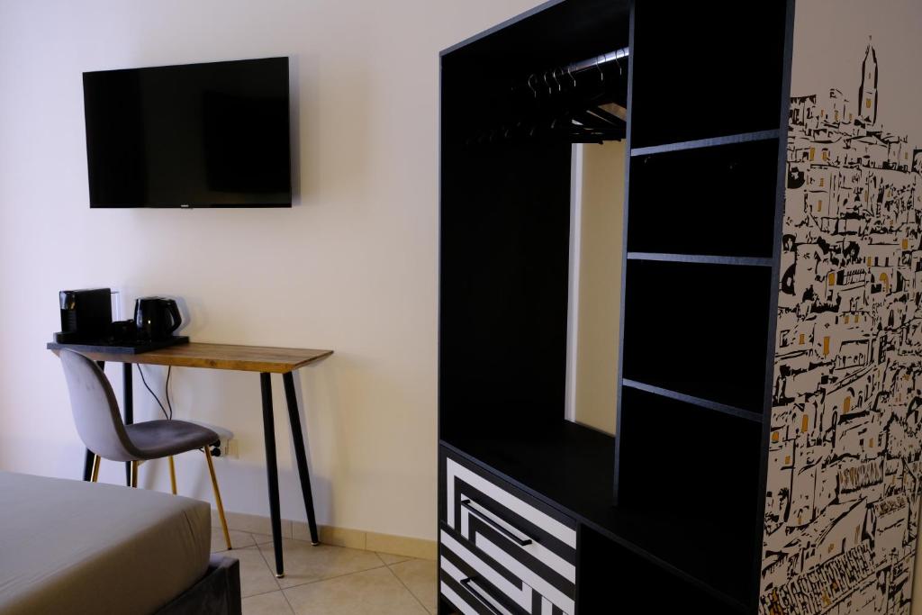 TV a/nebo společenská místnost v ubytování MATTEOTTI ROOMS