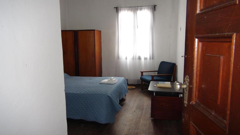 Postel nebo postele na pokoji v ubytování Hostal prado colonial