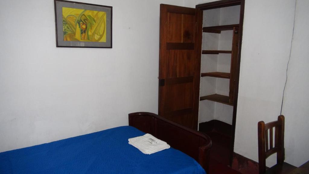 Postel nebo postele na pokoji v ubytování Hostal prado colonial