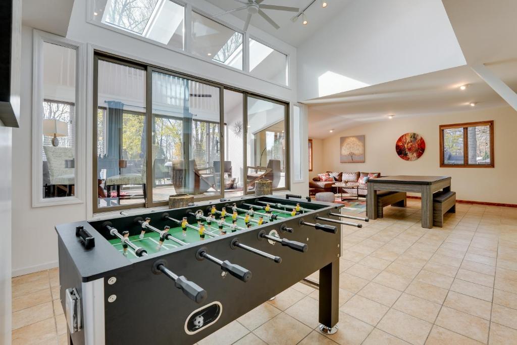 a large living room with a foosball table at Cassopolis Vacation Home - Walk to Diamond Lake! in Cassopolis