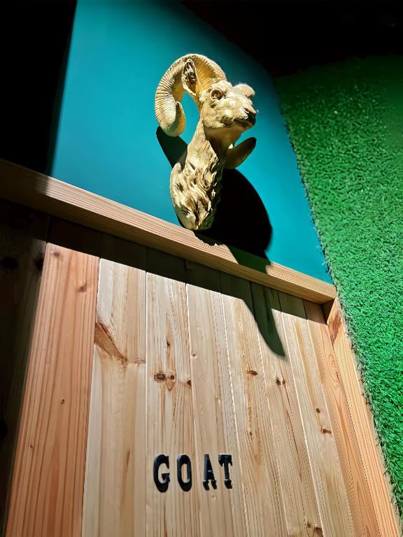 a goat figurine sitting on top of a building at Kenting Original Hostel in Kenting