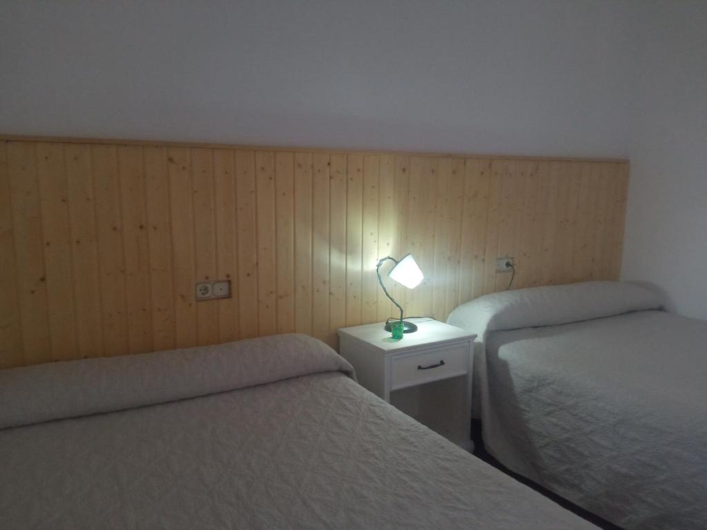 Postel nebo postele na pokoji v ubytování Apartamentos Virgen de Villaverde