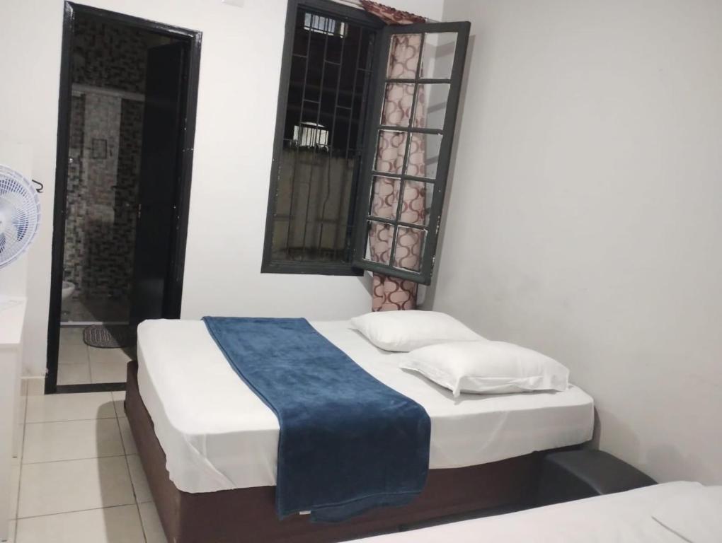 Postel nebo postele na pokoji v ubytování Hotel Real Centro