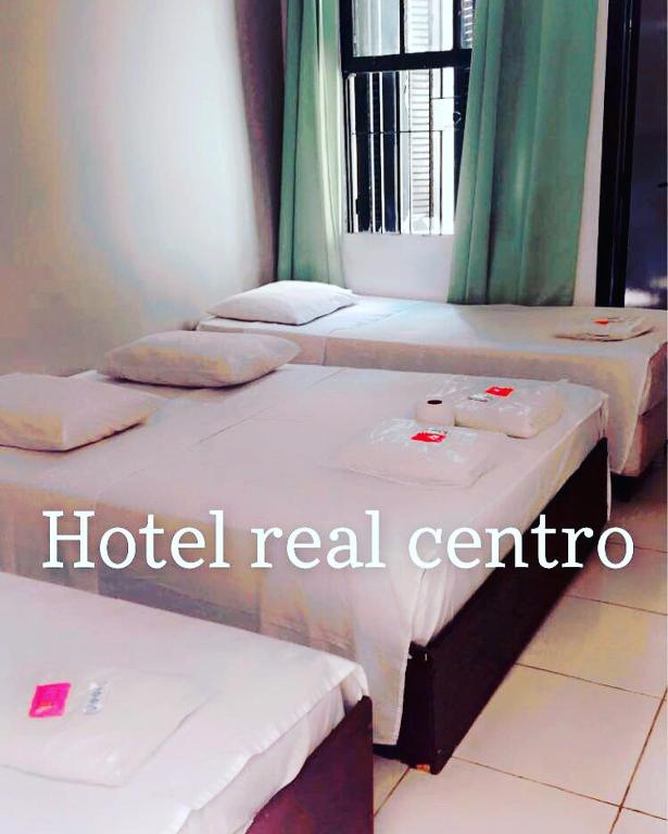 Postel nebo postele na pokoji v ubytování Hotel Real Centro