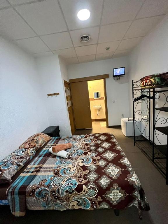 Postel nebo postele na pokoji v ubytování Hostal Milan
