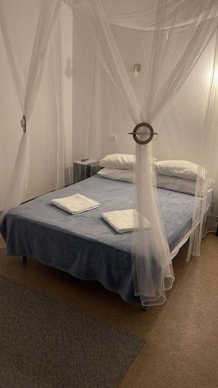 Postel nebo postele na pokoji v ubytování Hotel ENZO