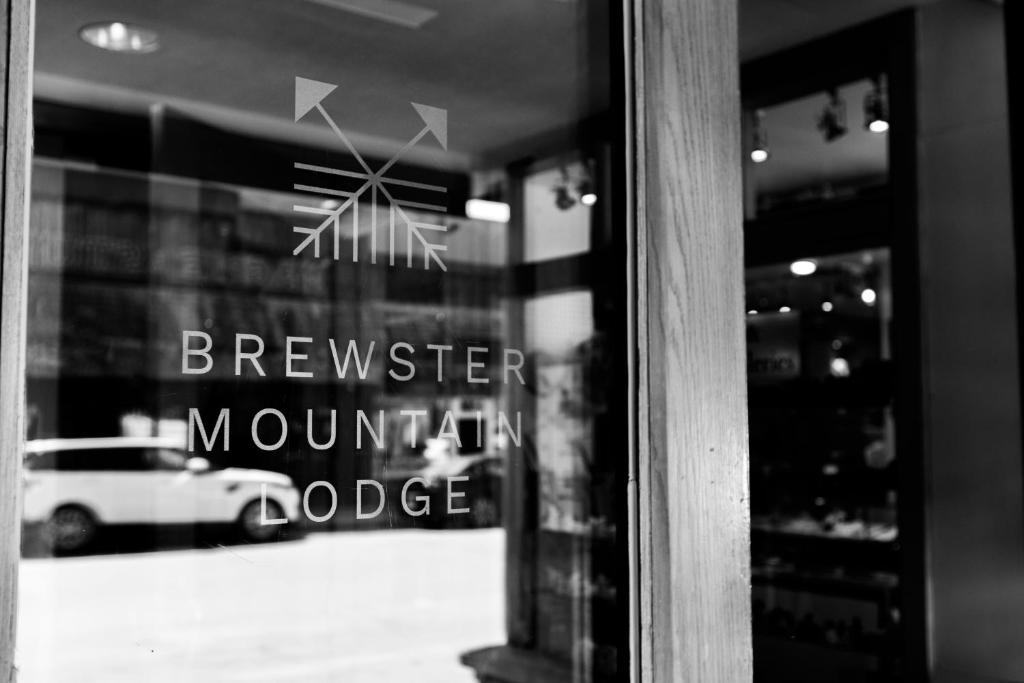 a window of a bakery with a sign on it at Brewster Mountain Lodge in Banff