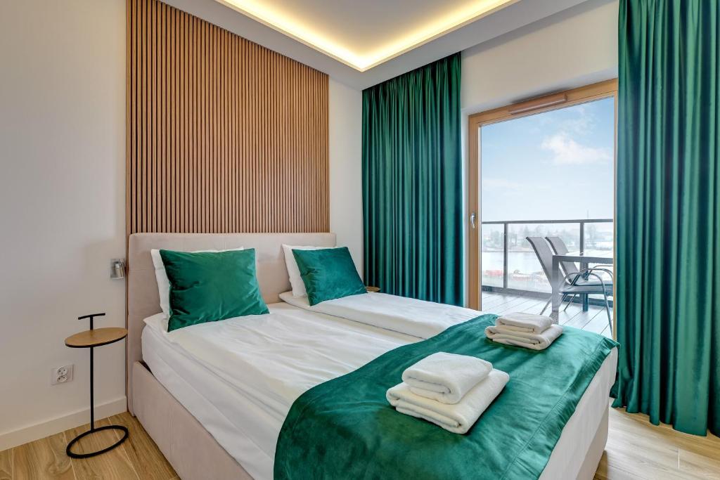 Postel nebo postele na pokoji v ubytování Nadmotławie Sauna & Gym by Blue Mandarin