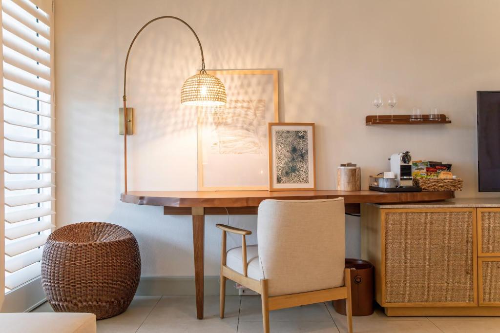 a dining room with a table and a chair at Islander Resort in Islamorada