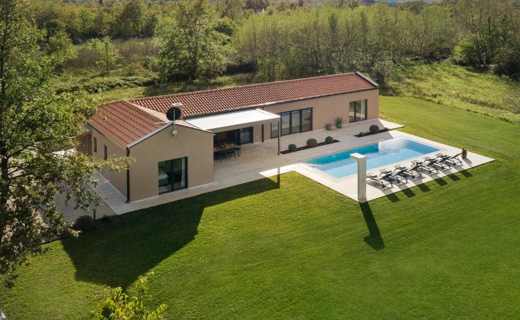 an aerial view of a house with a swimming pool at Villa Vesna - Premium Collection in Sveti Petar u Šumi