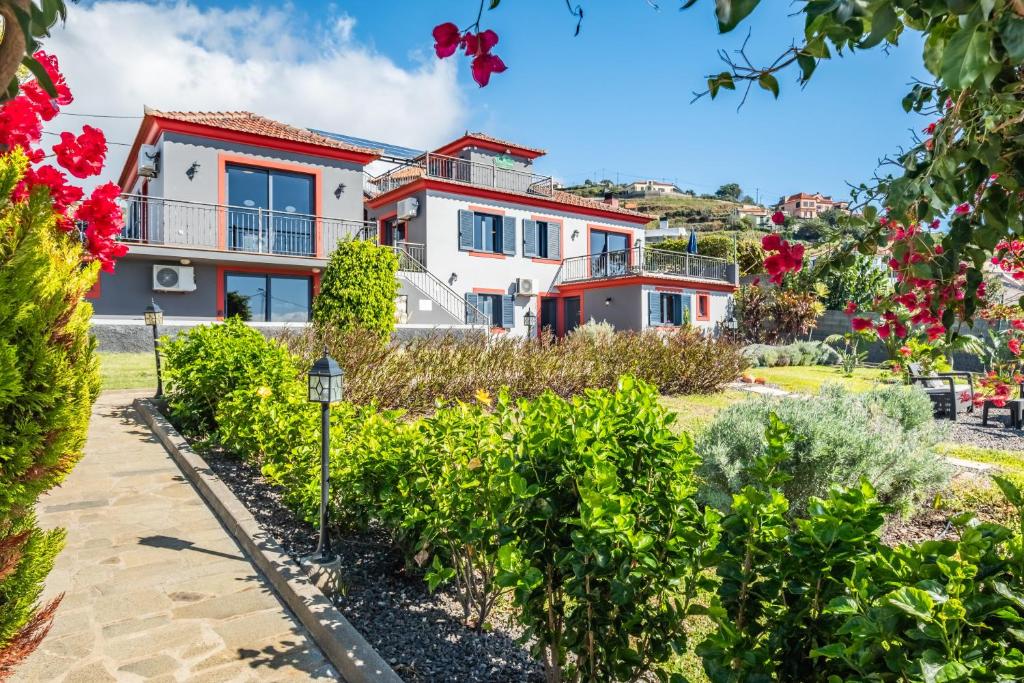a villa with a view of a house at Vila Brava Cottage in Ribeira Brava