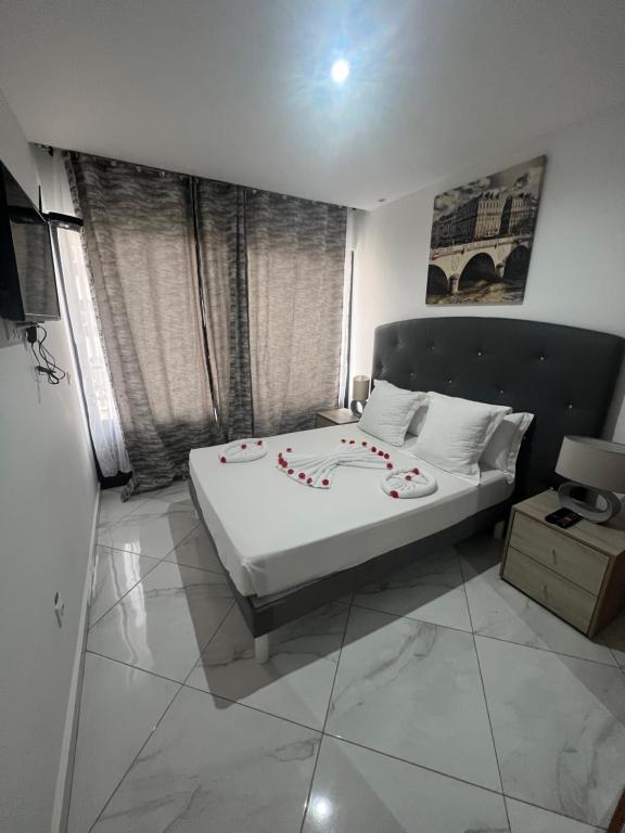 Residencial Santo Amaro tesisinde bir odada yatak veya yataklar