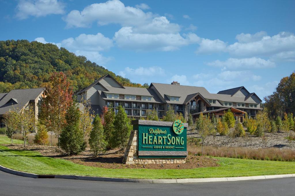 a welcome sign in front of a large house at Dollywood's HeartSong Lodge & Resort in Pigeon Forge