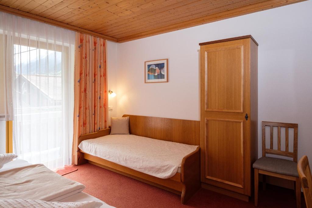 Letto o letti in una camera di Hotel Garni DIAS