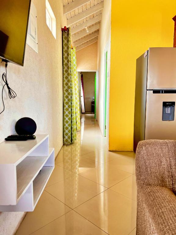 a hallway with a refrigerator in a room at Cozy Modern Upstairs 2 Bed A/C Apt Near 2 Everything in Saint Philip